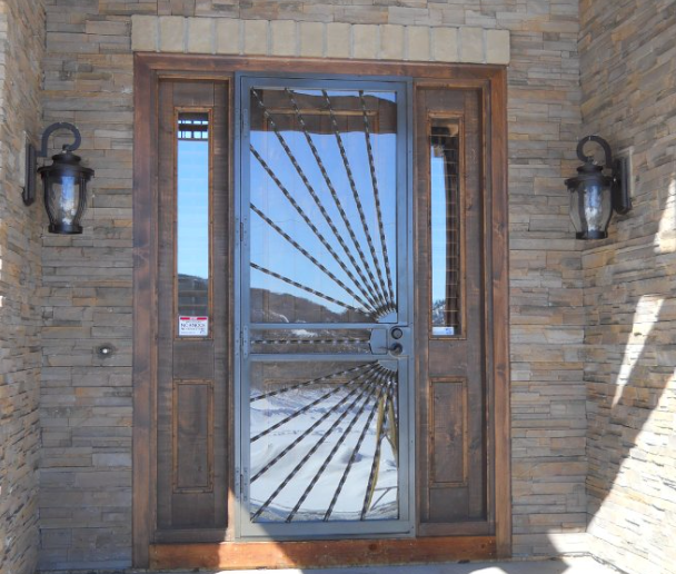 A custom steel door provides security and style to the entryway of a home