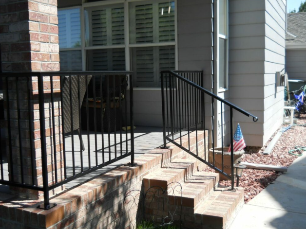 Steel porch railing secures and enhances a front porch
